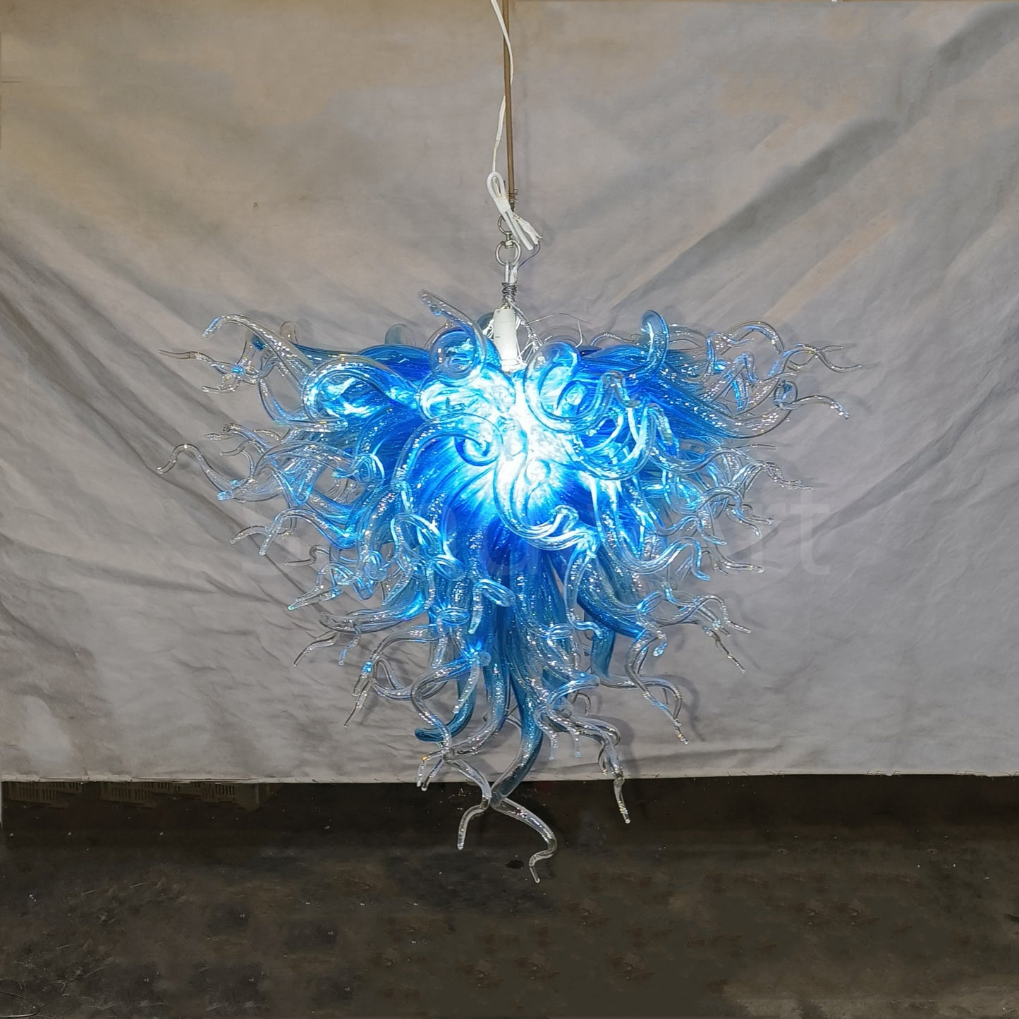 Blue with clear custom blown glass chandeliers Inspired by Chihuly style lighting