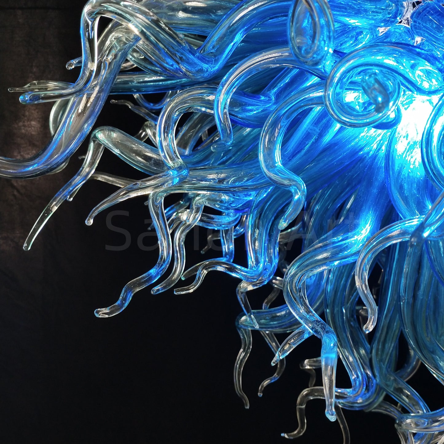 Blue with clear custom blown glass chandeliers Inspired by Chihuly style lighting