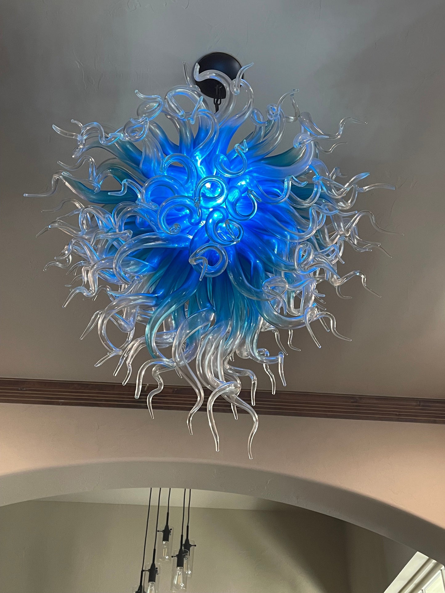 Blue with clear custom blown glass chandeliers Inspired by Chihuly style lighting