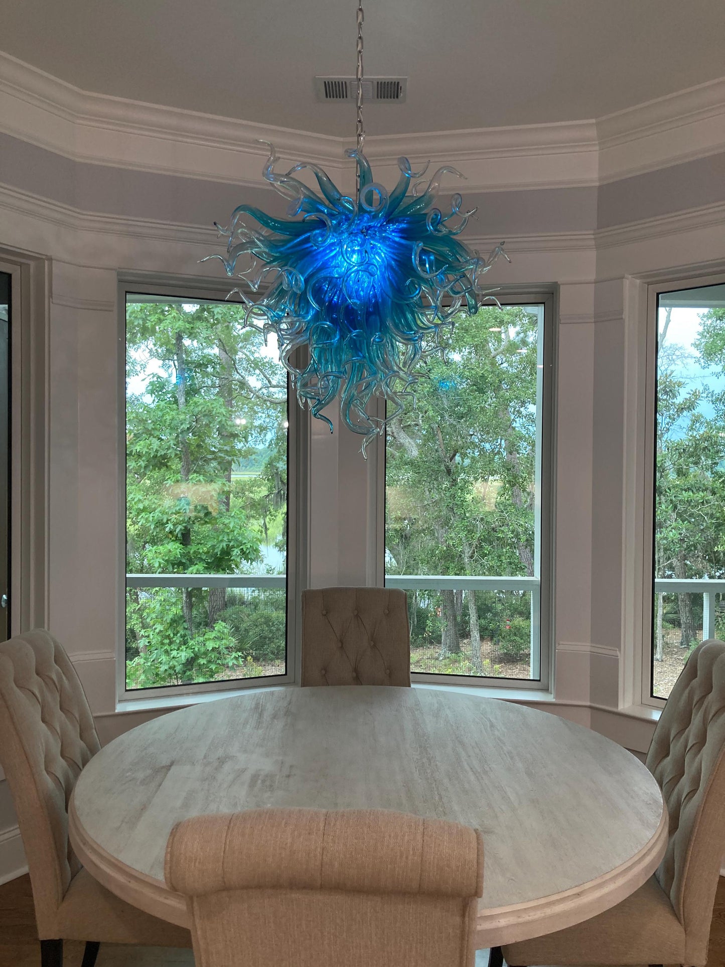 Blue with clear custom blown glass chandeliers Inspired by Chihuly style lighting