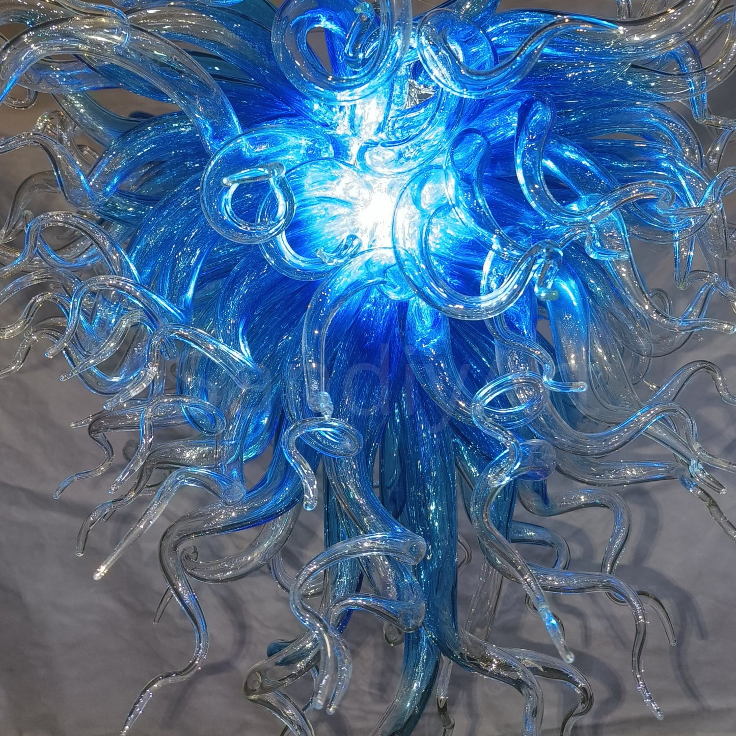 Blue with clear custom blown glass chandeliers Inspired by Chihuly style lighting