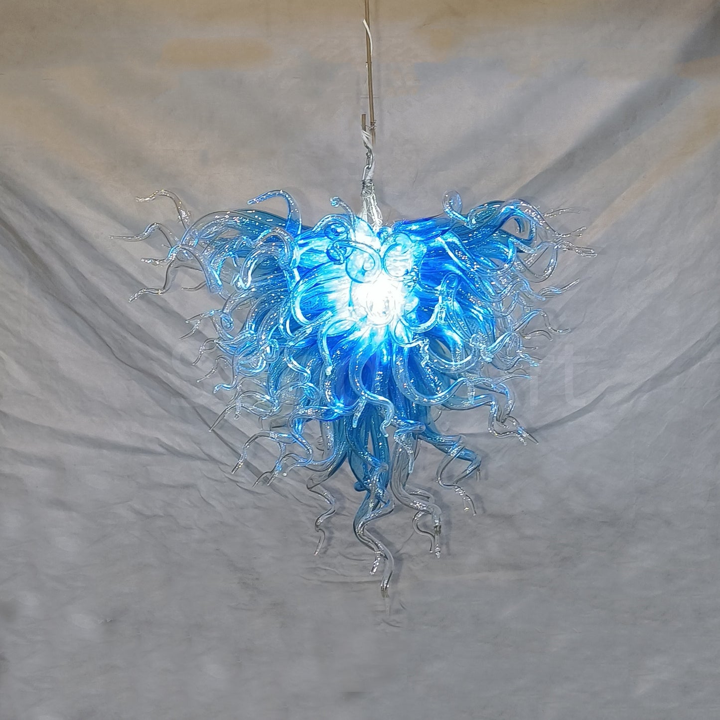 Blue with clear custom blown glass chandeliers Inspired by Chihuly style lighting