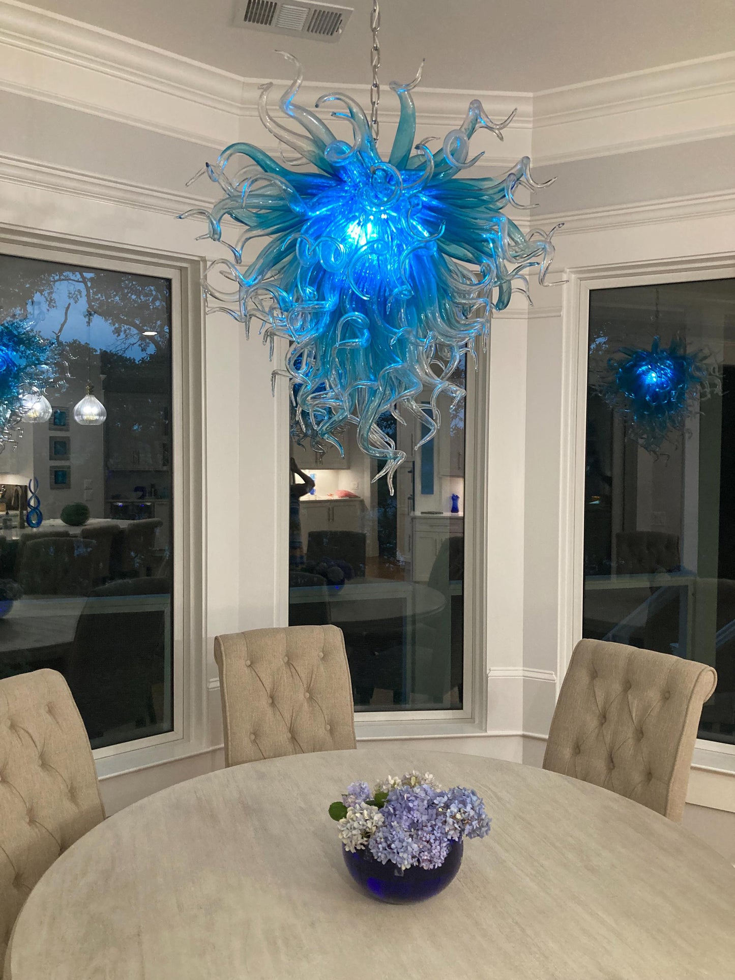 Blue with clear custom blown glass chandeliers Inspired by Chihuly style lighting