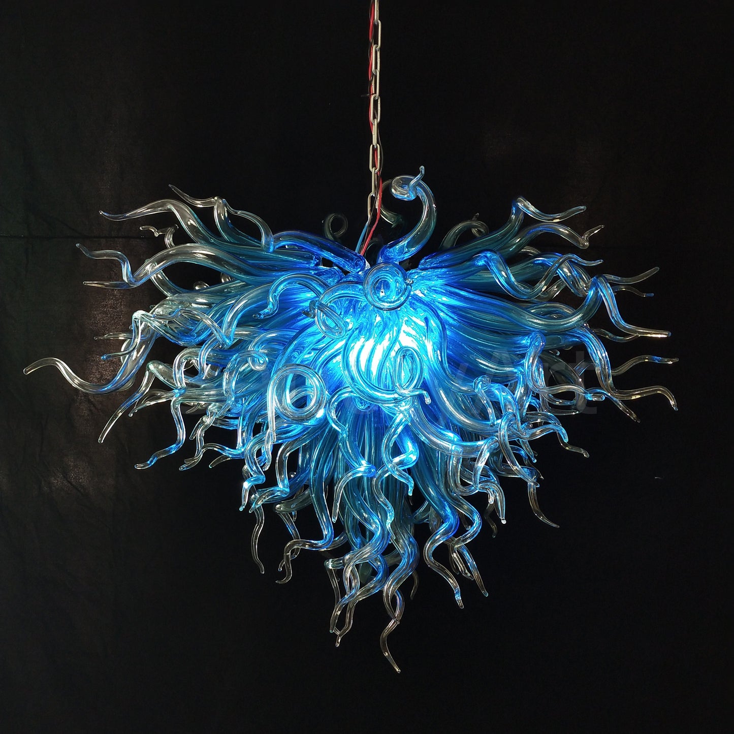 Blue with clear custom blown glass chandeliers Inspired by Chihuly style lighting