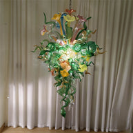 Inspiration from nature Custom glass chandelier with green leaves and red orange pink flowers