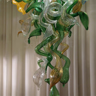 Inspiration from nature Custom glass chandelier with green leaves and red orange pink flowers